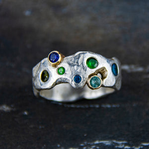 Rockpool Ring, a textured sterling silver ring set with gemstones to reflect the colour of the sea