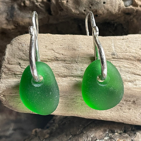 Silver earrings with emerald green sea glass drops