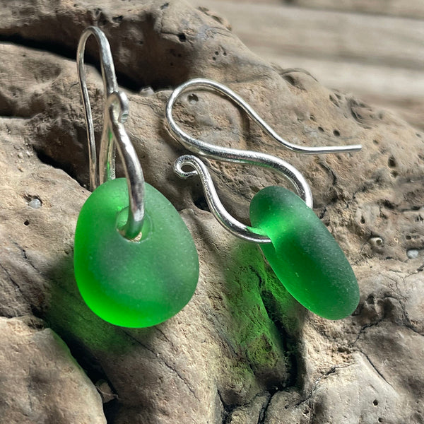 Silver earrings with emerald green sea glass drops