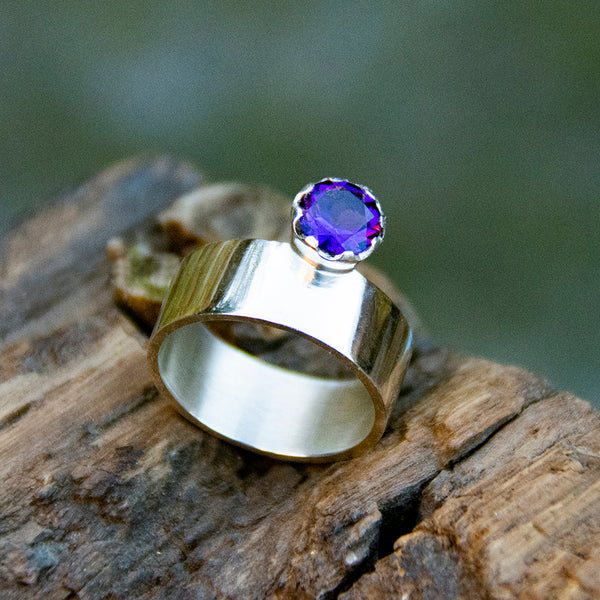 Silver ring with purple gemstone