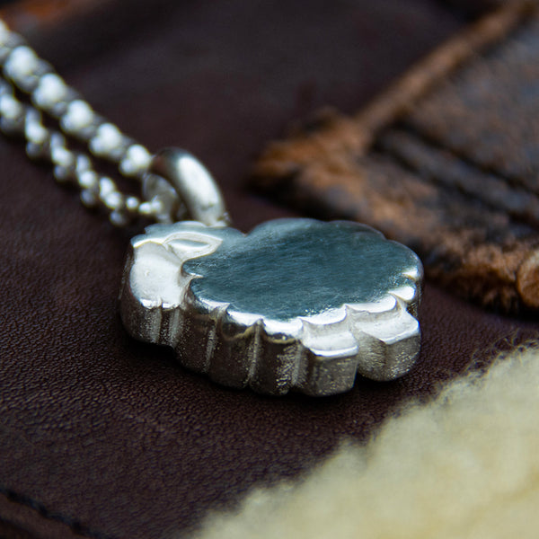 Solid silver sheep pendant. Carved in jewellers wax and cast using the lost wax casting process.